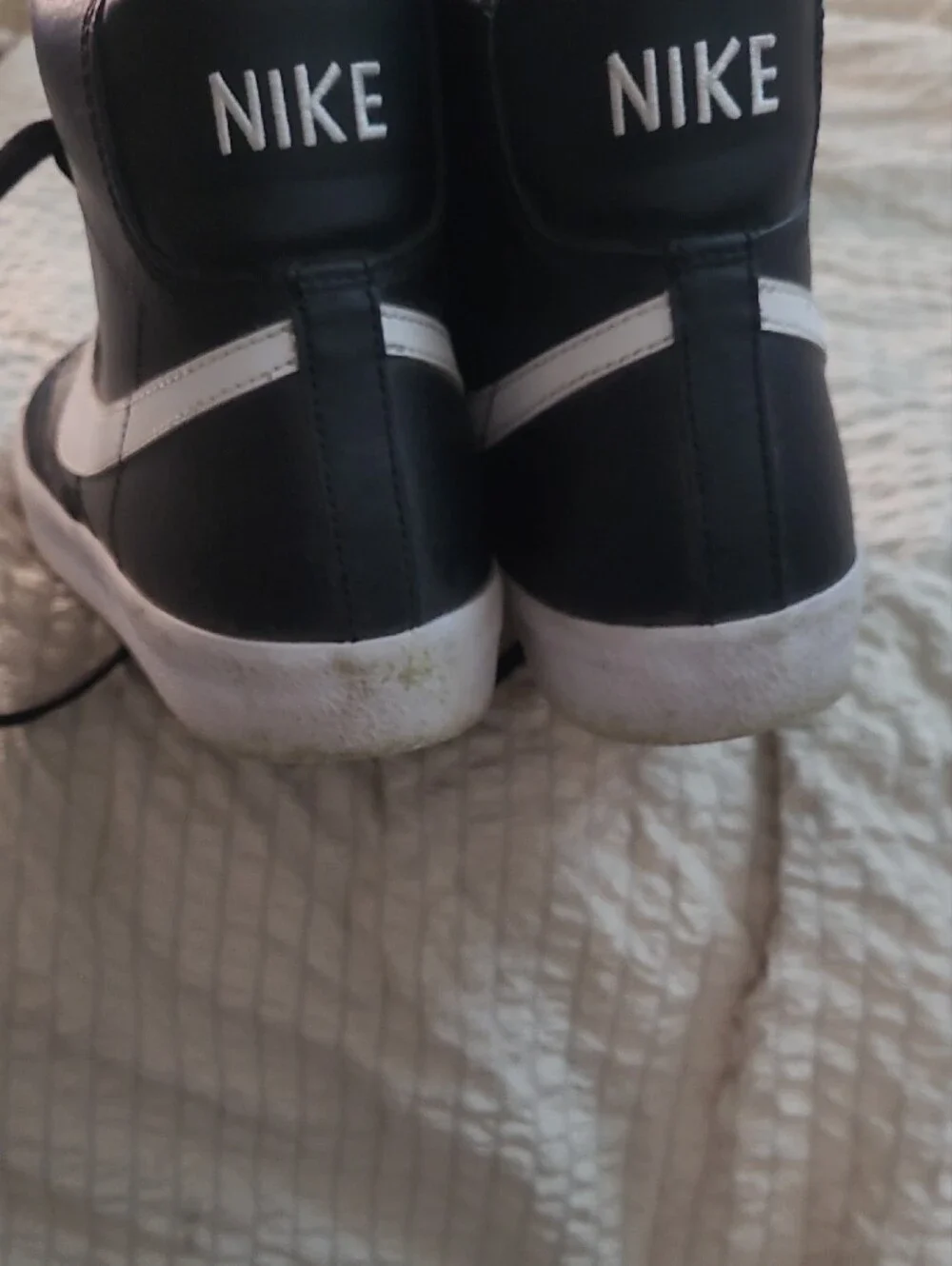 Nike Black High-Top Sneaker with White Swoosh